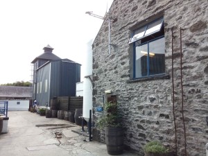 Kilchoman distillery. The stillhouse in the front and the kiln in the background