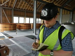 A whisky blogger blocking the view of the water tanks and washbacks (Picture credit: Jo)