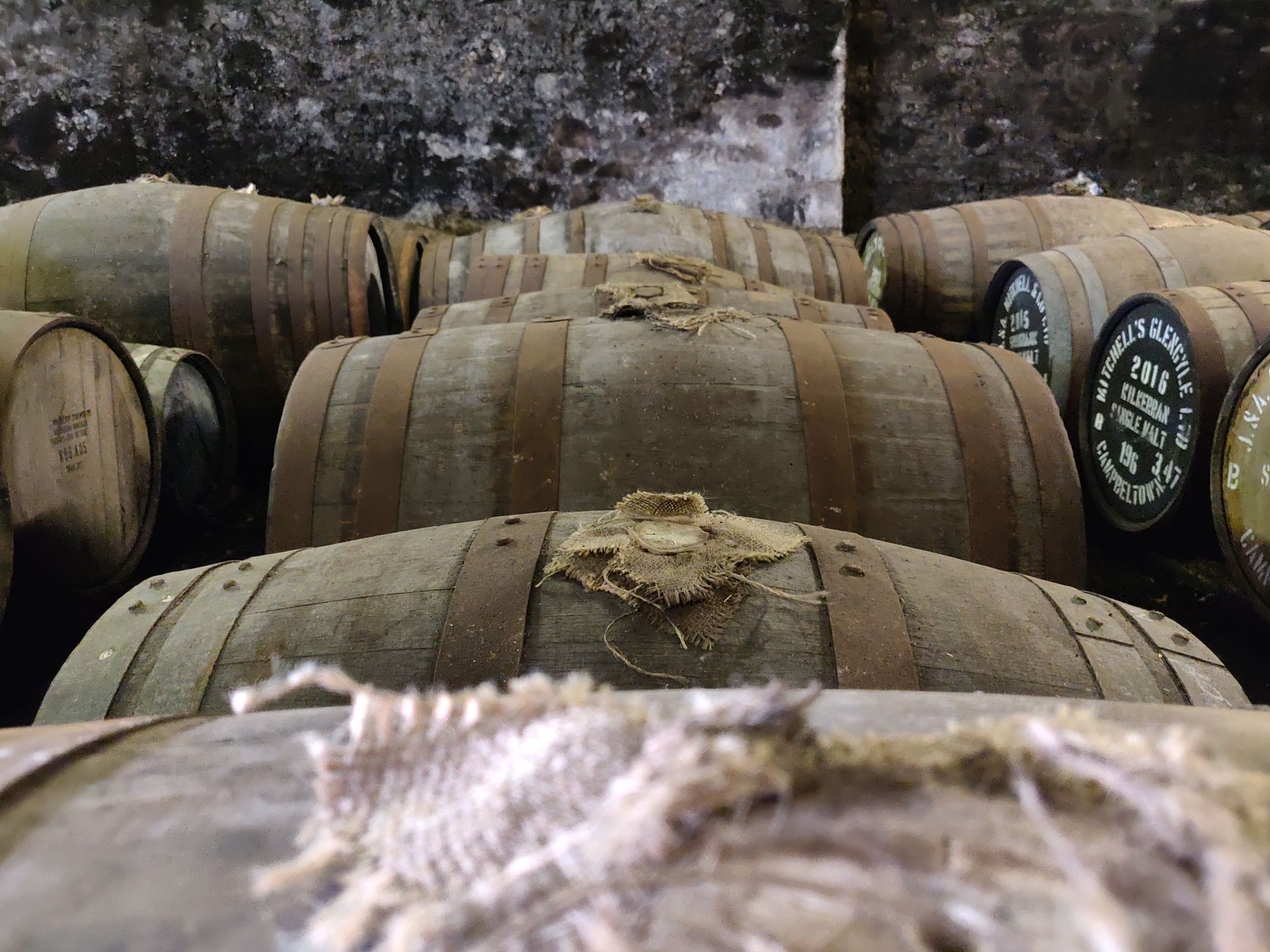 Casks in a whisky warehouse at Springbank distillery, Scotland